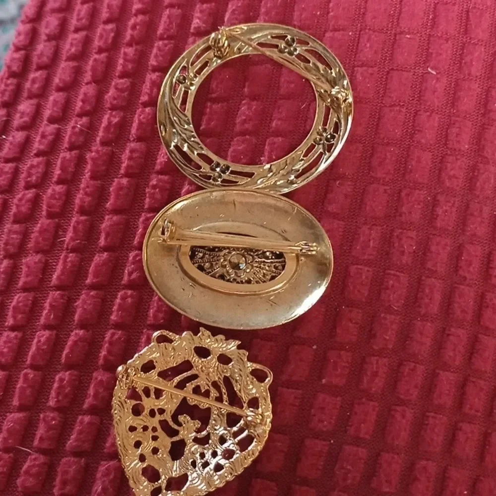 Three vintage brooches